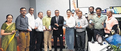 Actor Miya George, Kochi Metro managing director Loknath Behera and other officials after inaugurating the WhatsApp ticket facility on Tuesday