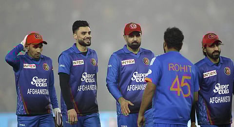 Afghanistans cricketers greet Indian captain Rohit Sharma at the end of the first T20 cricket match between India and Afghanistan in Mohali, India. (Photo | AP)
