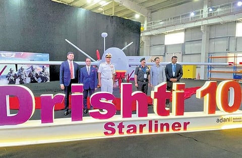 Navy chief Admiral R Hari Kumar during the unveiling of Drishti 10 Starliner UAV at Adani Aerospace Park in Hyderabad on Wednesday; (Right) Drishti 10 UAV | express