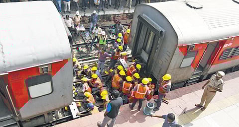 Railway workers carry out repair works to the derailed coaches of Charminar Express in Hyderabad on Wednesday; (Below) A derailed bogie of the train | Vinay Madapu