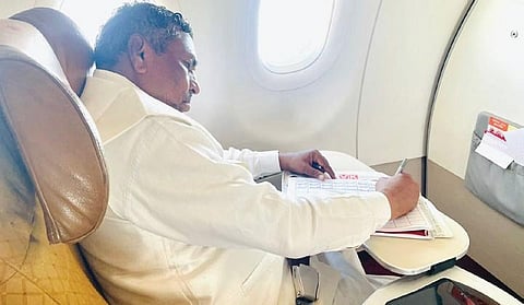 Minister KH Muniyappa writes the Ramakoti on a Bengaluru-Delhi flight