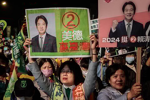 Supporters hold up posters of Lai Ching-te, presidential candidate for the ruling Democratic Progressive Party (DPP), during an election campaign rally in Tainan on January 12, 2024. (Photo | AFP)