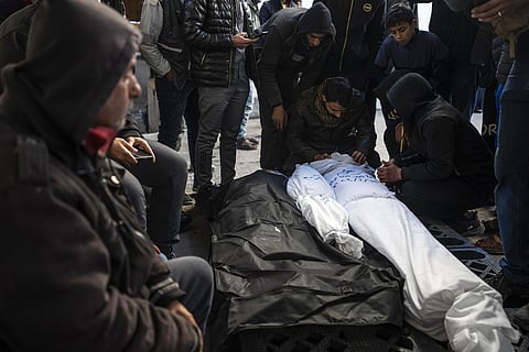Palestinians mourn relatives killed in the Israeli bombardment of the Gaza Strip in Rafah, Saturday, Jan. 13, 2024. (Photo | AP)