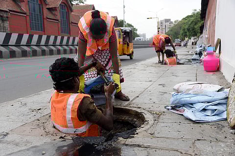 Chennai Contract labours clearing the drainage without safety measures at E.V.R.High road Periyamet in chennai on Monday