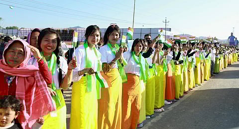 People gather to welcome Congress leader Rahul Gandhi during the 'Bharat Jodo Nyay Yatra', in Thoubal district, Manipur, on Jan. 14, 2024. 