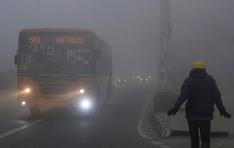 Vehicles ply on road amid low visibility during fog on a cold winter morning, in New Delhi, Sunday, Jan. 14, 2024. (Photo | PTI)