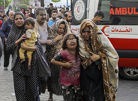 Injured Palestinians arrive at al-Shifa Hospital following Israeli airstrikes on Gaza City, central Gaza Strip, Monday, Oct. 16, 2023. | AP