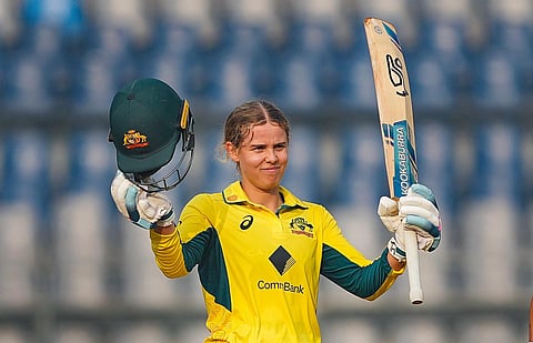 Australia's Phoebe Litchfield celebrates after scoring a century during the third ODI cricket match between India and Australia. (Photo| PTI)
