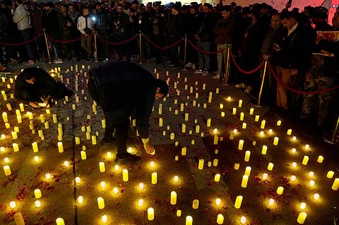 Iraqis light candles marking the fourth anniversary of the death of General Qassem Soleimani, head of Iran's Quds Force, who was killed in a US air strike in Baghdad in 2020. (Photo| AP)
