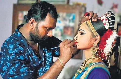 ​  Anu Stephen, a makeup artist, making final touches before a competition   ​
