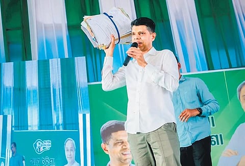 VK Pandian showing the petitions received during the public meeting. 