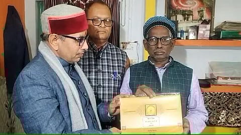 Iqbal Ansari receiving the invitation (Photo | Special arrangement)