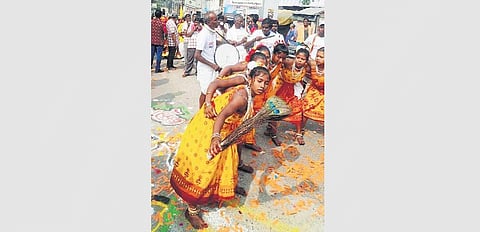 Artistes perform during the procession