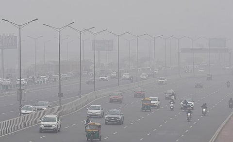 Commuters during a cold and foggy winter morning, in New Delhi | Parveen Negi, eps