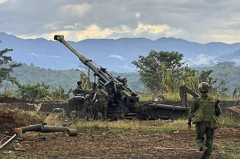 Members of a rebel group check weapons allegedly seized from a Myanmar army outpost (Photo | AP)