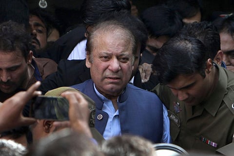Former Pakistan Prime Minister Nawaz Sharif leaves after appearing in a court in Lahore. (File Photo | PTI)