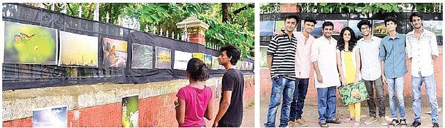 People take a look at  the photographs displayed  at  the <g class=