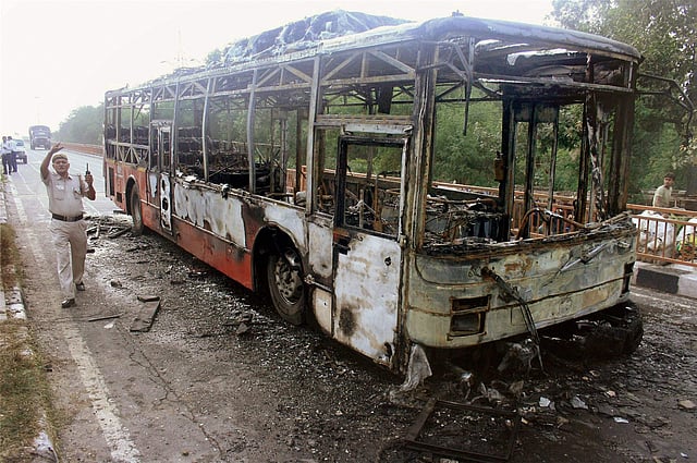 A DTC bus set on fire by followers of Dera Sacha Sauda chief Gurmeet Ram Rahim after his conviction in a rape case in New Delhi on Friday. (PTI)