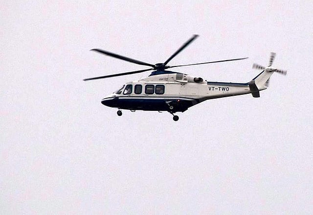 A helicopter believed to be transporting Dera Sacha Sauda sect chief Gurmeet Ram Rahim flies over Rohtak on Friday. (PTI)