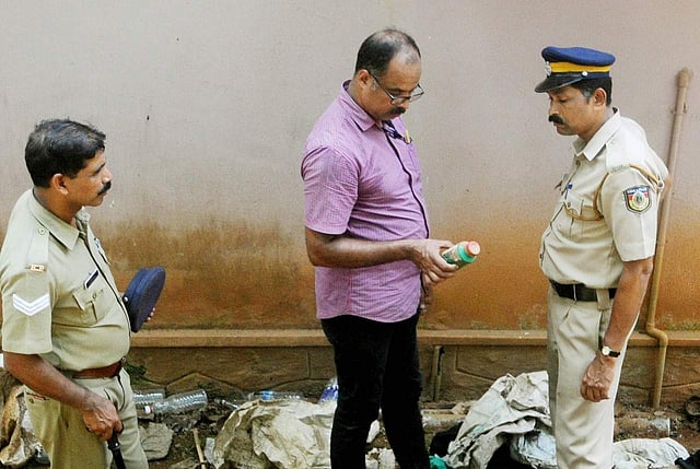 Police collecting evidence from the Ponnamattam house at Koodathayi in Thamarassery. ( Photo | TP Sooraj )