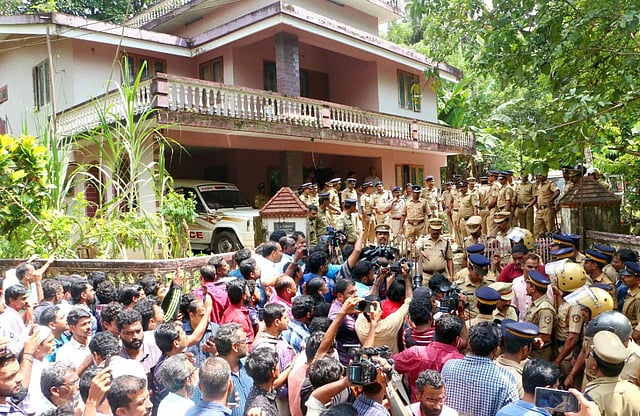 A huge crowd gathered in front of the Ponnamattam house to catch a glimpse of Jollyamma, the prime accused in the serial killing at Koodathayi near Thamarassery in Kozhikode. ( Photo | TP Sooraj )