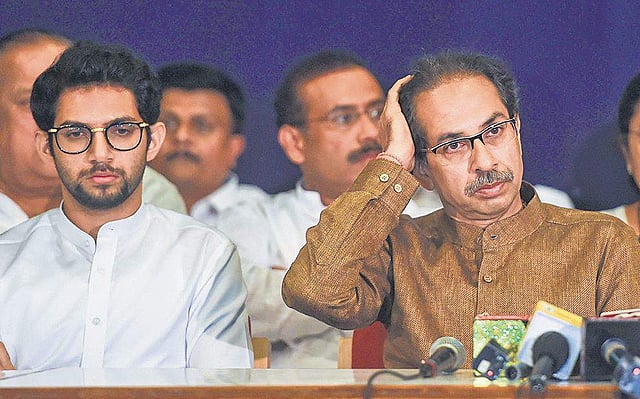 Shiv Sena Chief Uddhav Thackeray with son and Yuva Sena chief Aaditya Thackeray during a joint press conference in Mumbai on Saturday. (Photo | PTI)