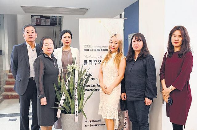 (second from left) Mi Ryung Maeng with students 