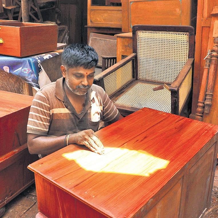 Indian Carpenter Polishing Wooden Furniture