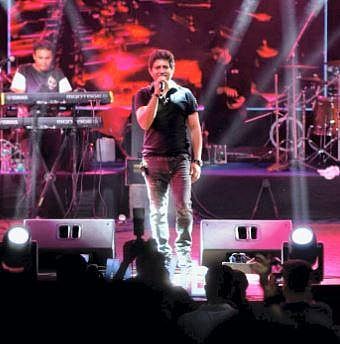 Bollywood playback singer Krishnakumar Kunnath, popularly known as 'KK' during his performance, at Nazrul Mancha in Kolkata. (Photo | PTI)