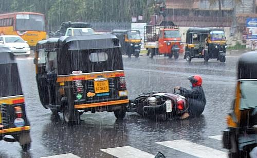 A two-wheeler rider seen slipping and falling at the signal near Kerala  Secretariat. (File Photo | B P Deepu, EPS)