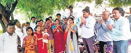 Tribals greet the team of revenue officials that visited the hamlet I express