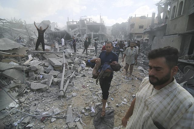 Palestinians evacuate wounded in Israeli bombardment of Rafah, southern Gaza Strip, Tuesday, Oct. 17, 2023 | AP