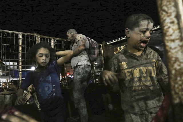 Wounded Palestinians arrive at the al-Shifa hospital, on a truck, following Israeli airstrikes on Gaza City, central Gaza Strip, Thursday, Oct. 19, 2023. (Photo | AP)
