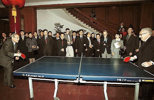 FILE - Then-Chinese Vice Premier Li Lanqing (L), plays table tennis with Henry Kissinger, at the Diaoyutai State Guesthouse in Beijing on Sunday, March 18, 2001. (Photo | AP)