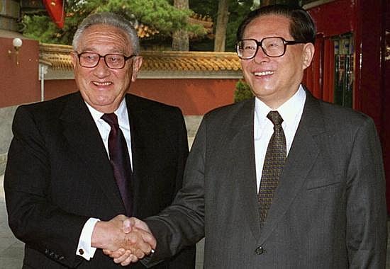 FILE - Former US Secretary of State Henry Kissinger poses with then-Chinese President Jiang Zemin (R), in Beijing on Wednesday, June 18, 1997. (Photo | AP)