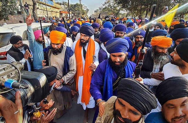  'Waris Punjab De' founder Amritpal Singh along with his supporters arrive at the police station demanding release of his associate, at Ajnala near Amritsar, Thursday. (Photo | PTI)