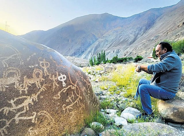 Wangchuk Tsering Fargo admires Nurla rock art