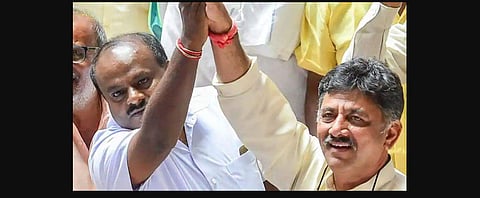 JD(S) leader HD Kumaraswamy with Congress leader D K Shivakumar. (Photo | PTI)