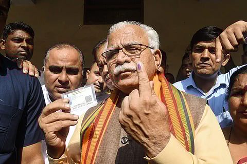Haryana Chief Minister Manohar Lal Khattar shows his finger marked with indelible ink after casting his vote. (Photo| PTI)