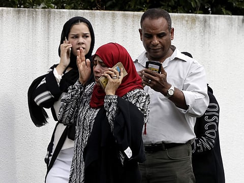 People wait outside a mosque in central Christchurch, New Zealand, Friday, March 15, 2019.  (Photo | AP)