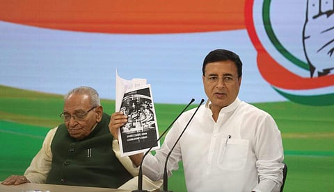 Congress spokesperson Randeep Surjewala reading out contents of a diary which reportedly holds details of a transaction between BS Yeddyurappa and BJP leaders, during a press meet on 22 March 2019. (Photo | Shekhar Yadav, EPS)