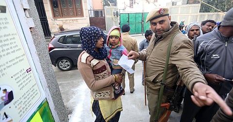 A voter at a polling station during the Delhi assembly elections in New Delhi. (Photo | Shekhar Yadav, EPS)