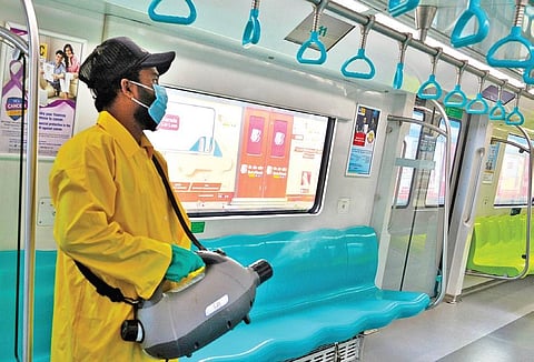 A worker carrying out disinfection inside a Metro coach recently.
