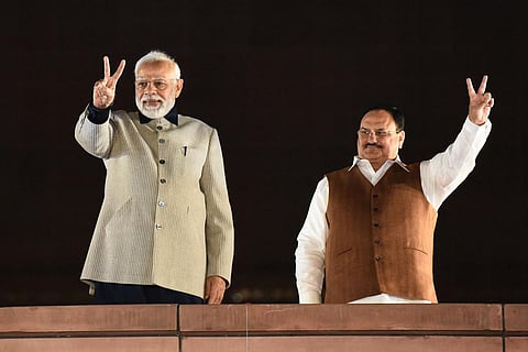 Prime Minister Narendra Modi waves at supporters during the celebrations of BJP's victory in the Gujarat Assembly elections, at party headquarters in New Delhi. (Photo | Parveen Negi, EPS)
