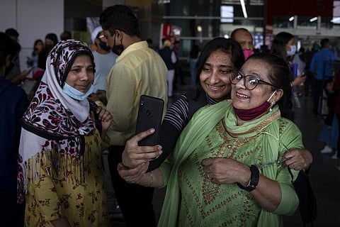 An Indian student studying in Ukraine takes a selfie with her mother upon her arrival at Indira Gandhi International Airport in New Delhi. (Photo | AP)