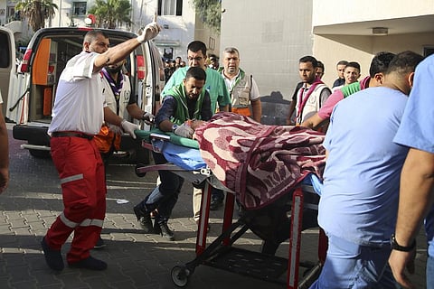 Palestinian wounded in Israeli strikes is brought to Shifa Hospital in Gaza City. (Photo | AP)