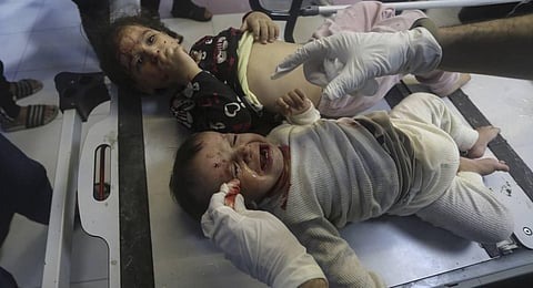 Wounded Palestinian children receive treatment at the al-Shifa hospital, following Israeli airstrikes on Gaza City, central Gaza Strip. 