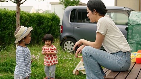 This photo provided by Japan Media Services shows a scene from The Ones Left Behind: The Plight of Single Mothers in Japan, directed by Rionne McAvoy.