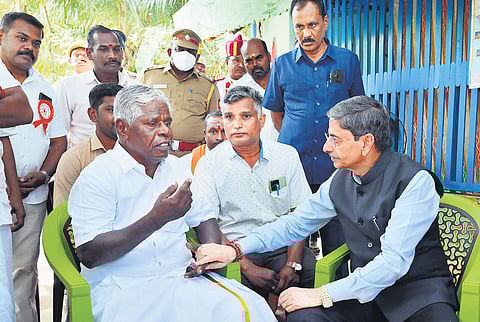 Governor RN Ravi visiting the Keezhvenmani massacre  survivor G Palanivel at his residence in Keezhvenmani on Sunday.