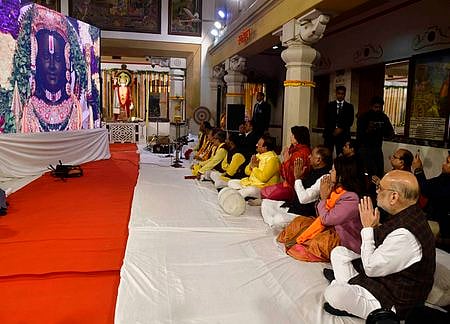 Union Home Minister Amit Shah with Union MoS for Culture Meenakashi Lekhi offers prayers at Laxmi Narayan Temple (Birla Mandir) ahead of the consecration ceremony of Ayodhya's Ram Mandir, in New Delhi, Monday, Jan. 22, 2024.